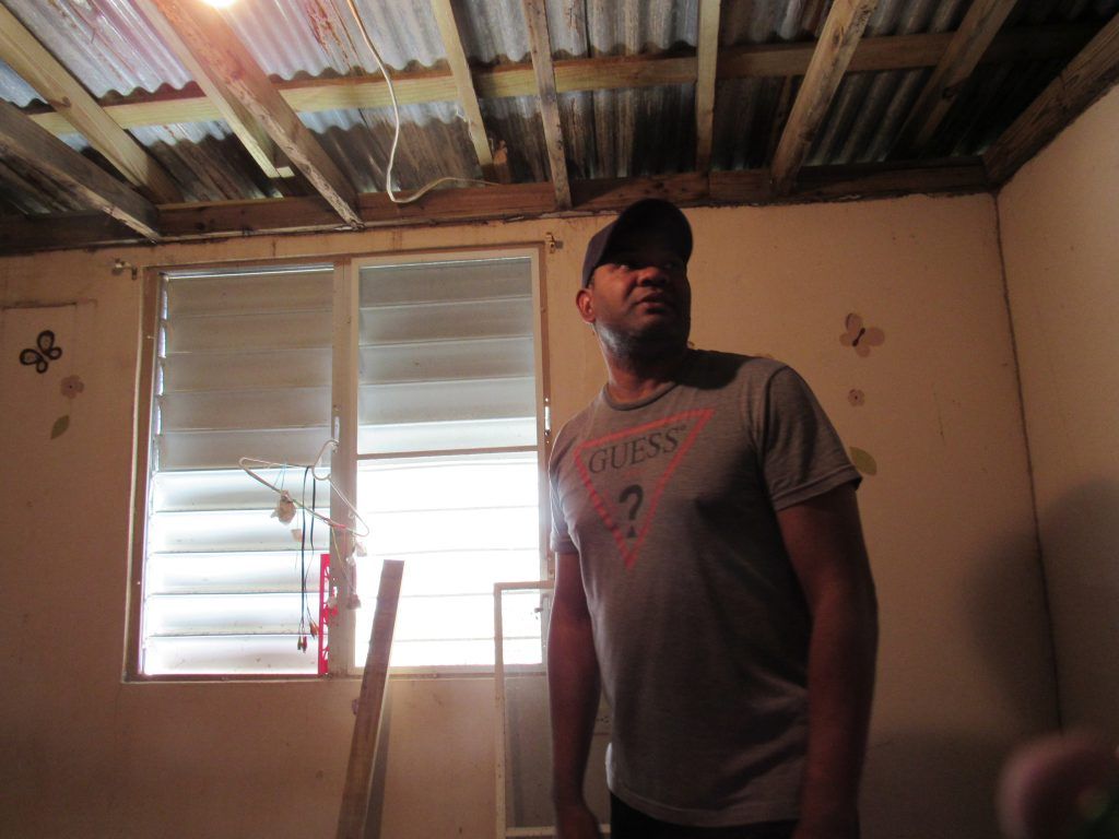 Guillermo Cardona’s home in the Parcelas Suarez community of Loiza was uninhabitable after Hurricane Maria, but as it sits in a flood zone, he was denied FEMA aid. Image by Kari Lydersen. United States, 2019.