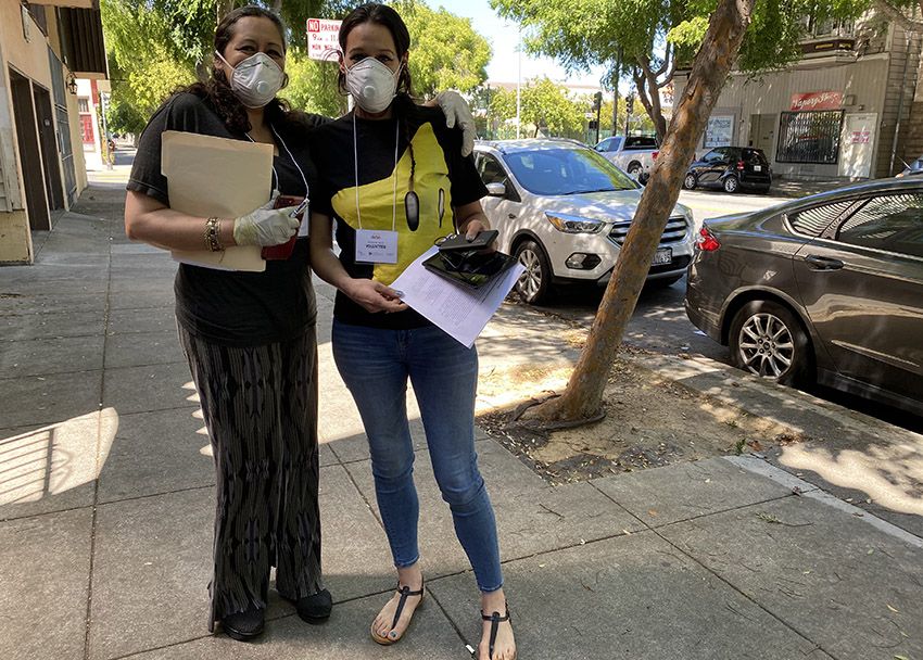 Marta Sanchez and her daughter Ciara going door-to-door for the Mission’s testing campaign. Image by Lydia Chávez. United States, 2020.