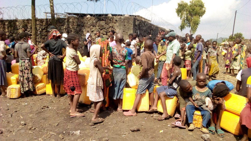 Waiting for water at a neighborhood tap in a Goma neighborhood. Image by Fred Mwasa and Sylidio Sebuharara. Democratic Republic of the Congo, undated.