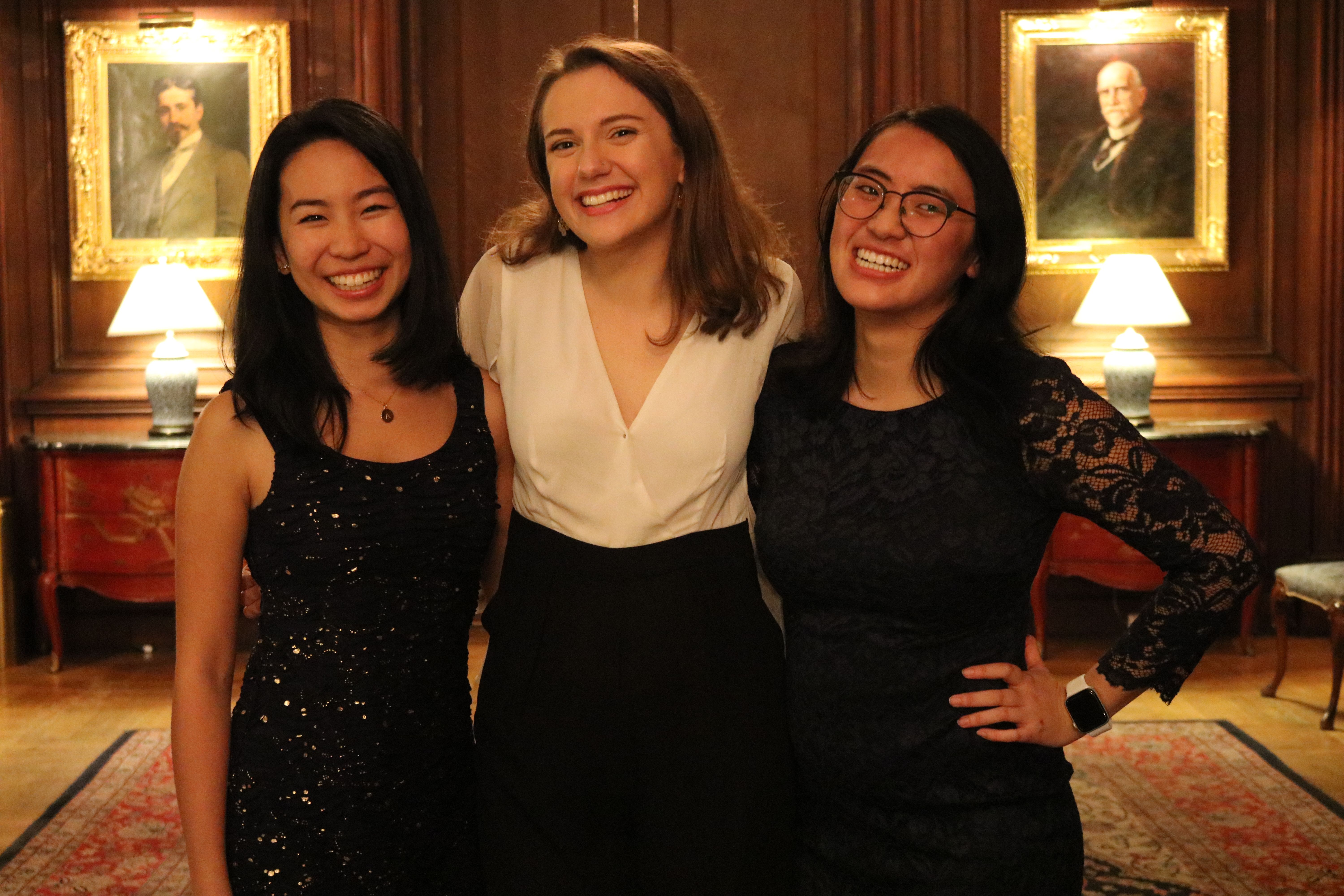 Pulitzer Center interns Ashley Zhang, Claire Seaton, and Karena Phan celebrate student fellows at the Cosmos Club. Image by Jin Ding. United States, 2018.