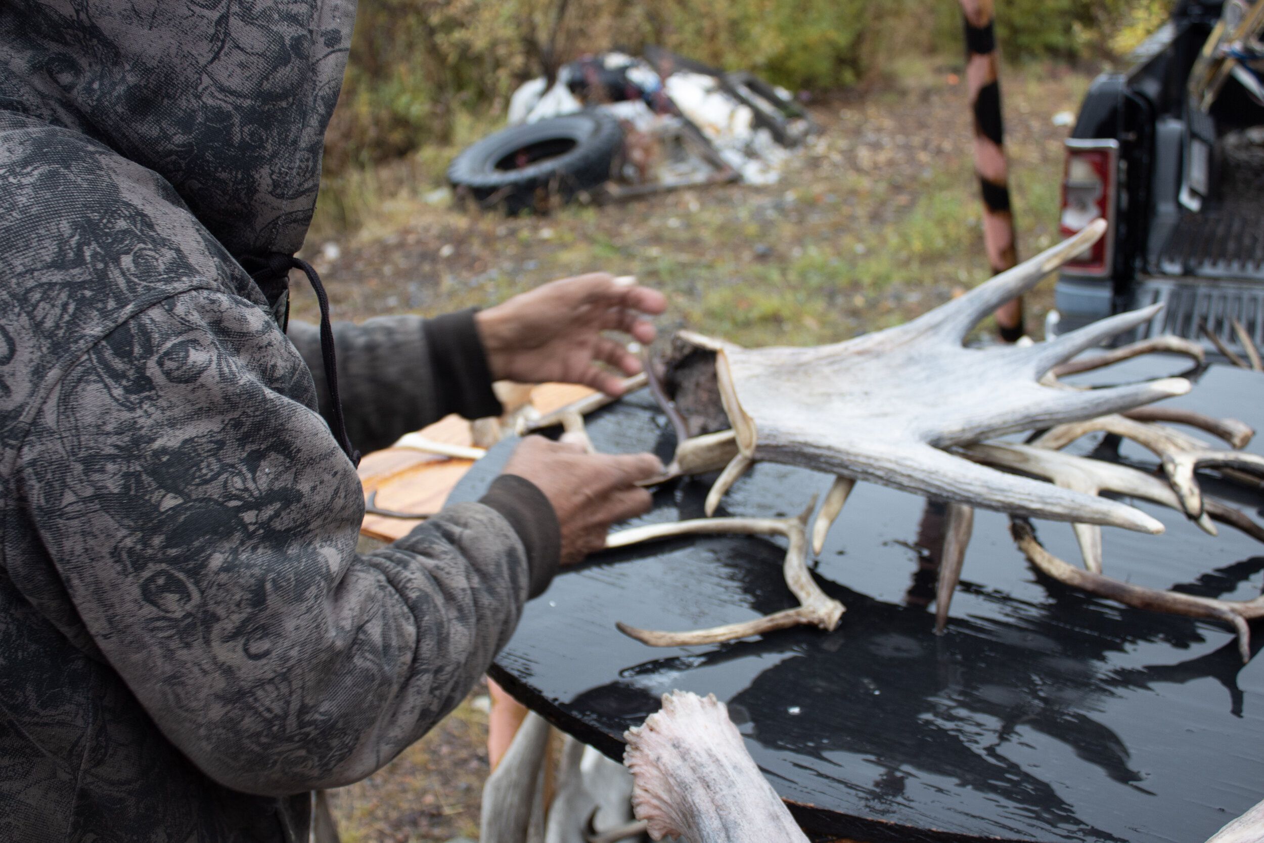 Gideon James uses caribou antlers to make jewelry and other art. Image by Amy Martin. United States, 2019.