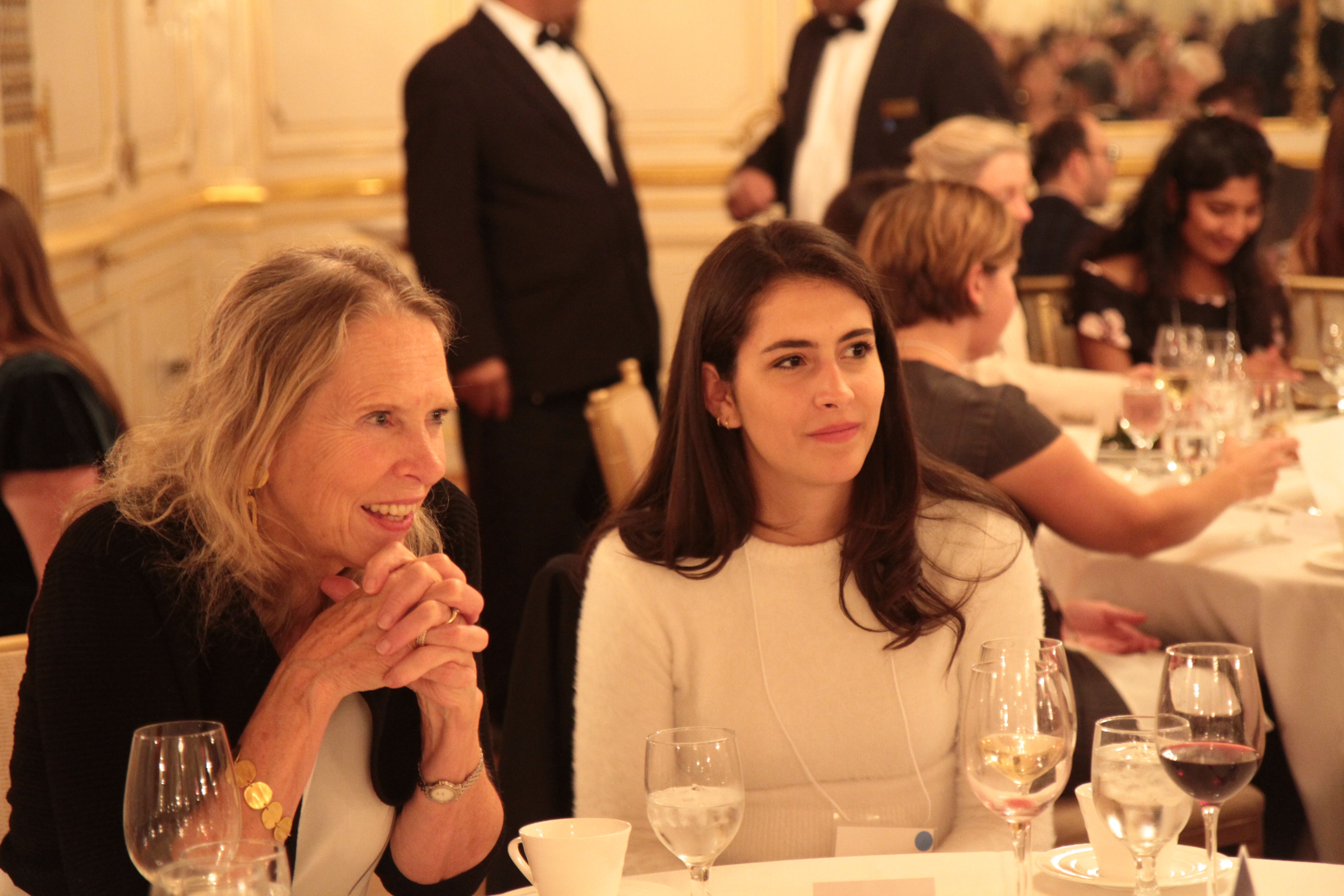 Kem Sawyer, contributing editor at the Pulitzer Center, and Mariana Rivas, Reporting Fellow from Texas Christian University, at the Cosmos Club. Photo by Libby Moeller. United States, 2019. 