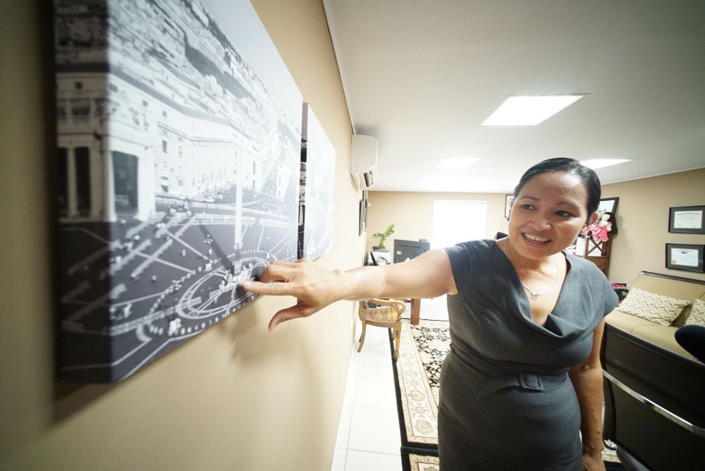 Jacqueline Taitano Terlaje, Apuron's attorney, points to a painting of the Vatican in her office. Image by Cory Lum. Guam, 2017.