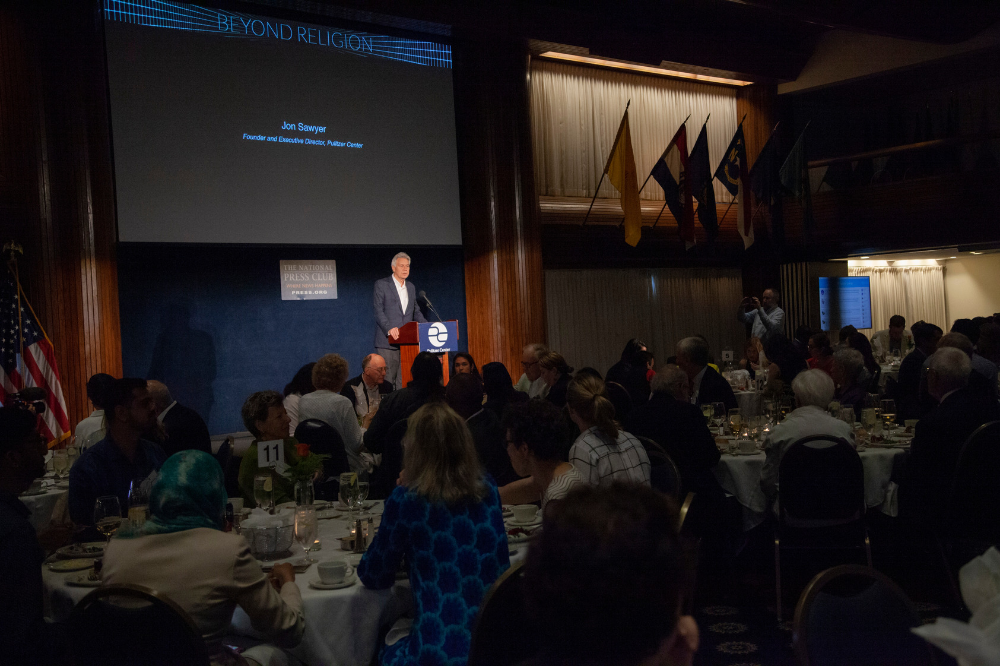 Executive Director Jon Sawyer speaks about the Pulitzer Center's relationship with the Luce Foundation and welcomes Michael Gilligan to the stage. Image by Jin Ding. United States, 2019.