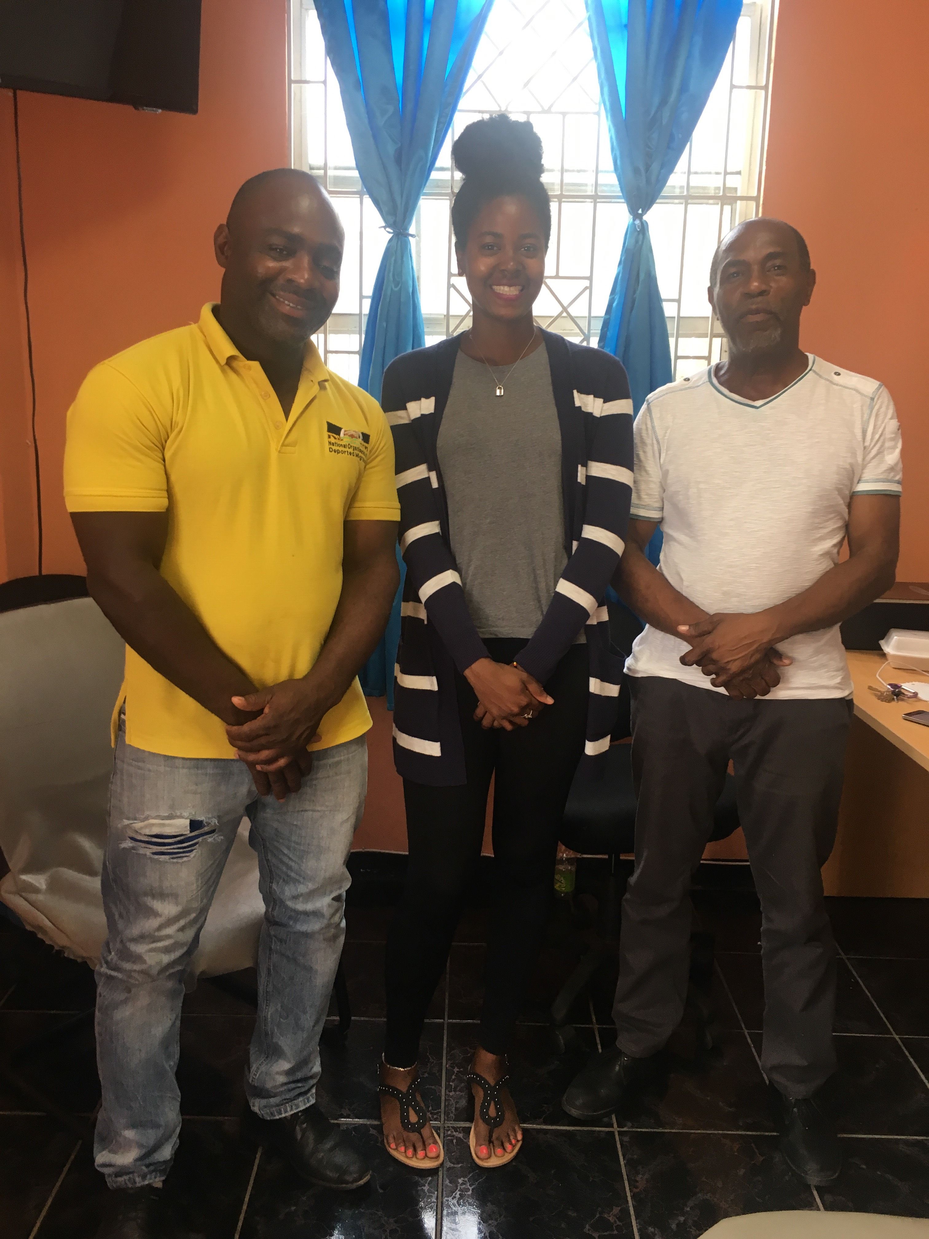 Monica Long (middle) poses alongside The National Organization of Deported Migrants (NODM) President Oswald Dawkins (left) and Treasurer Dwight Jones (right).  Image by NODM Vice President Anjuline Green. Jamaica, 2018.