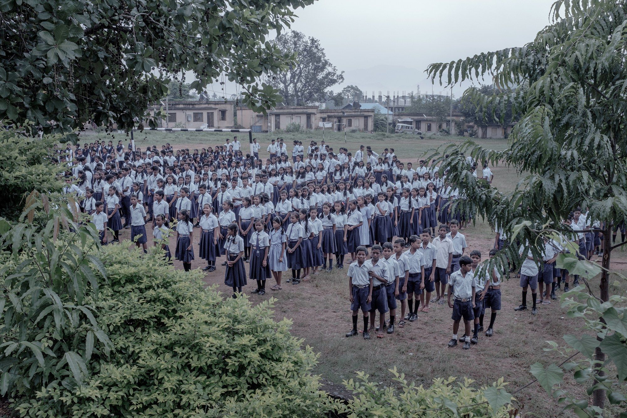 Assembly and morning prayers in the school playground. Image by Arko Datto. India, 2018.