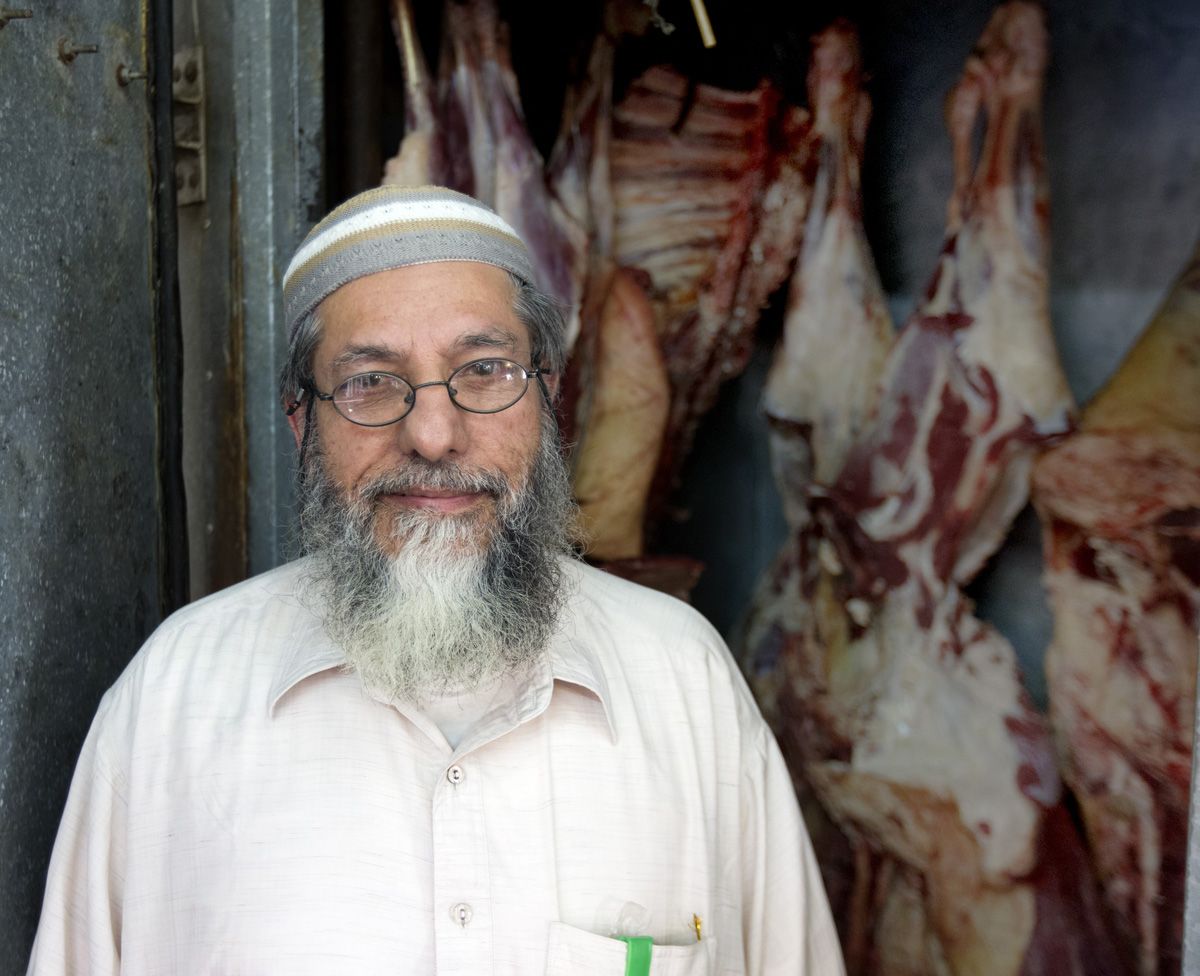 Mohammed Javed, owner of Highland Prime Cuts, is one of is the only butchers with a refrigerated meat locker at the public market. Image by Mark Hoffman. Kenya, 2017.