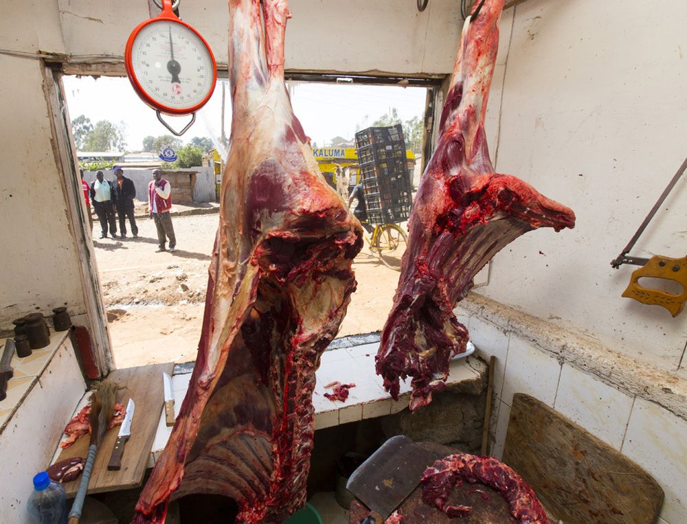 Each day the butcher shops sell meat that was slaughtered earlier in the morning. Image by Mark Hoffman. Kenya, 2017.