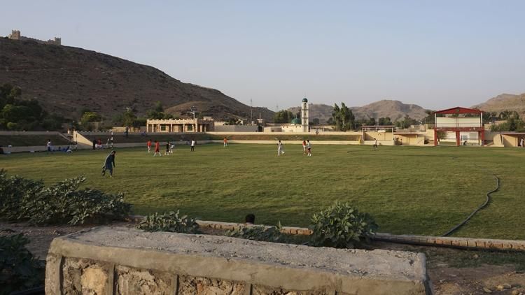 Locals play soccer in a new sports field built by the military in Miramshah. Image by Umar Farooq. Pakistan, 2017. 