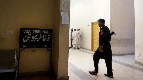 A tribal security officer keeps watch at the FATA Tribunal. Image by Umar Farooq. Pakistan, 2017.