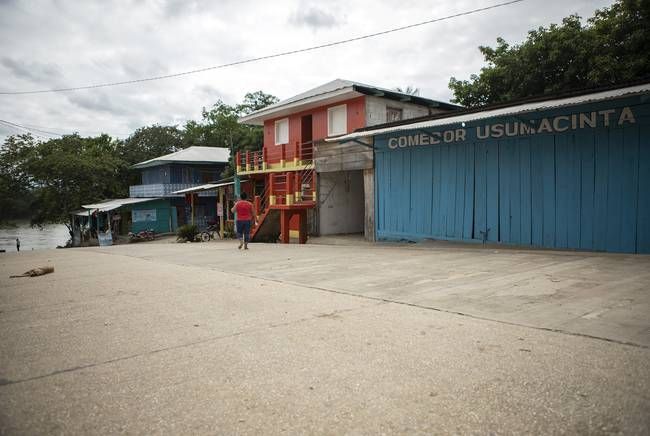The main street in La Técnica, Guatemala, leads to a boat dock on the Usumacinta River. Image by Miguel Gutierrez Jr. Guatemala, 2019.