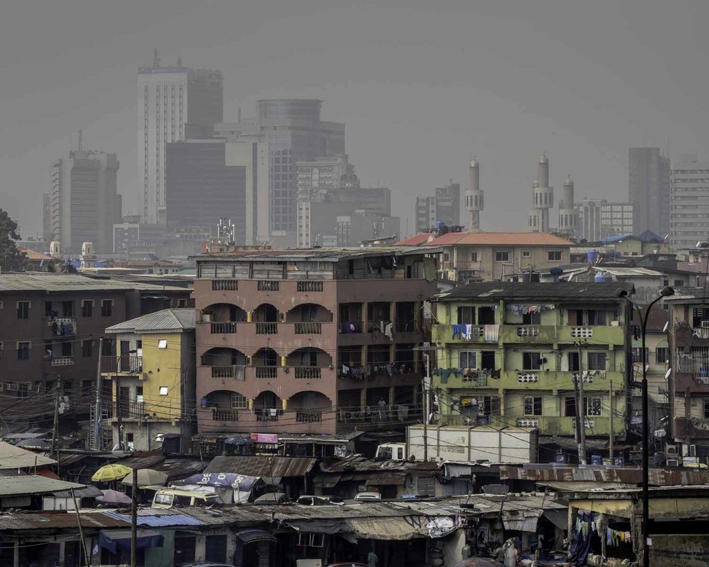 A haze of pollution hangs over fast-growing Lagos, Nigeria’s largest city and home to roughly 21 million people. Image by Larry C. Price. Nigeria, 2018.