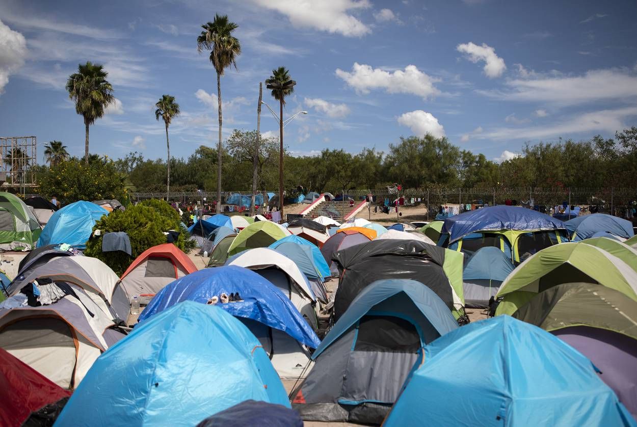 Approximately 2,000 migrants have camped near the entrance of the bridge in hopes of obtaining asylum in the United States. Image by Miguel Gutierrez Jr. Mexico, 2019.