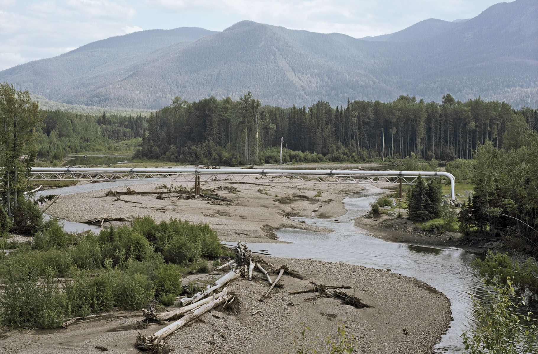 A Spectra Energy pipeline crosses the Pine River in northern British Columbia. Image by Jim McAuley. Canada, 2017.