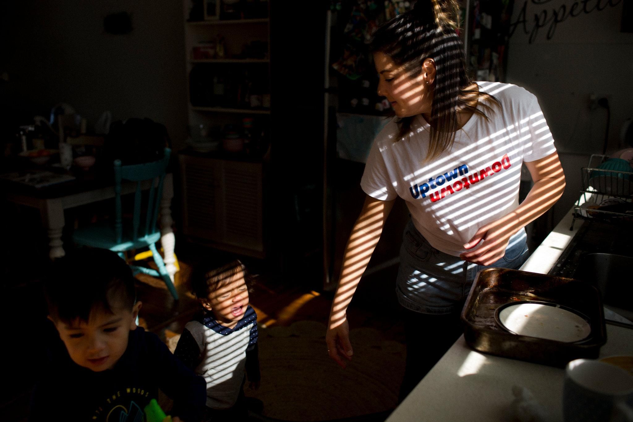 Renay Heng, Mr. Stowers’s partner, preparing to take their sons Isaiah, 3, and Zion, 1, to visit him in the detention center. Image by David Maurice Smith for The New York Times. Australia, 2018.