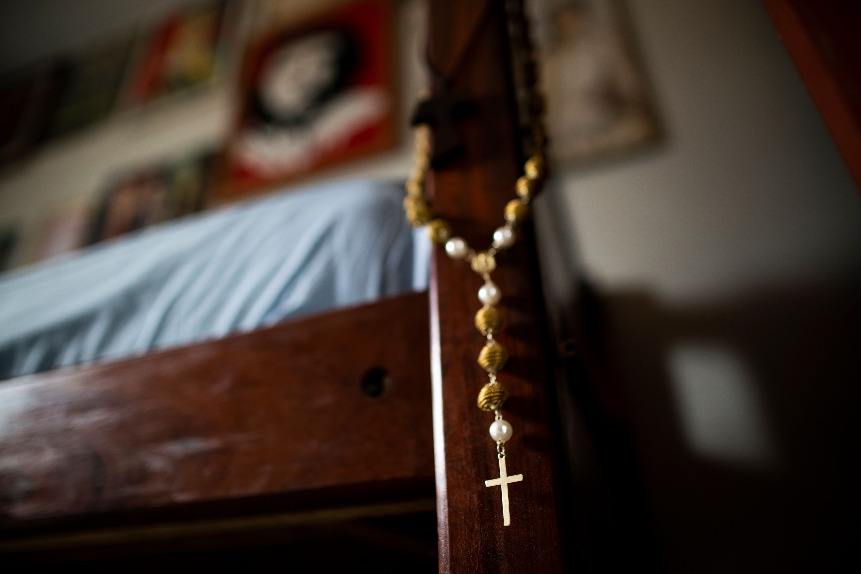 A necklace made of golden grass from Father Amaro Lopes’ childhood home of Maranhão hangs in his bedroom at the bishop’s house in Altamira. Image by Spenser Heaps. Brazil, 2019.