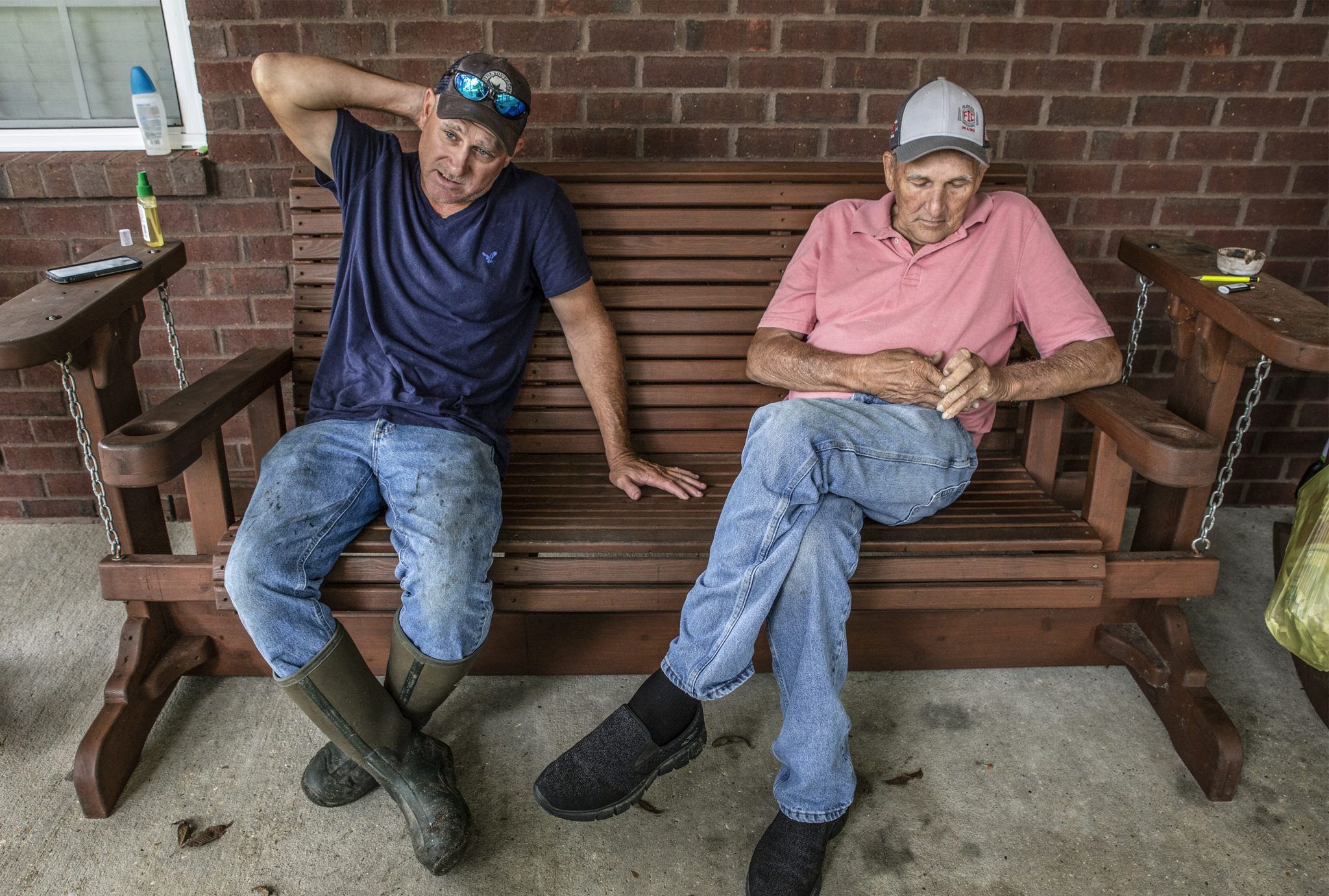 Fishermen Chad Stork, left, and Wayne Tillman at Stork’s home in Lucedale. Chad Stork is a fifth-generation fisherman. “I reckon it’s in my blood,” he said. Image by Eric J. Shelton for Mississippi Today. United States, 2019.