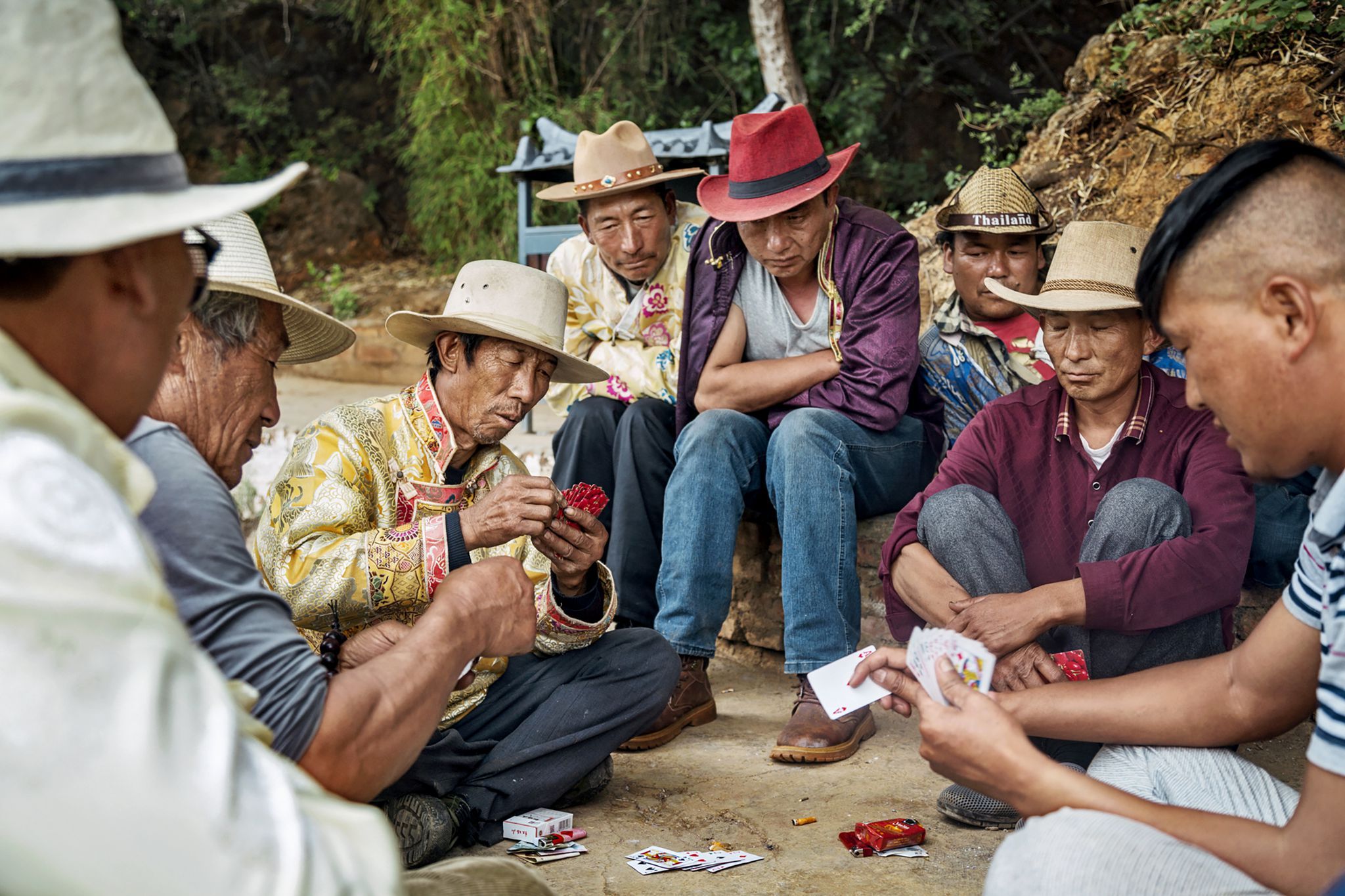 Mosuo men play an afternoon game of cards by Lugu Lake. Image by Jason Motlagh. China, 2017.
