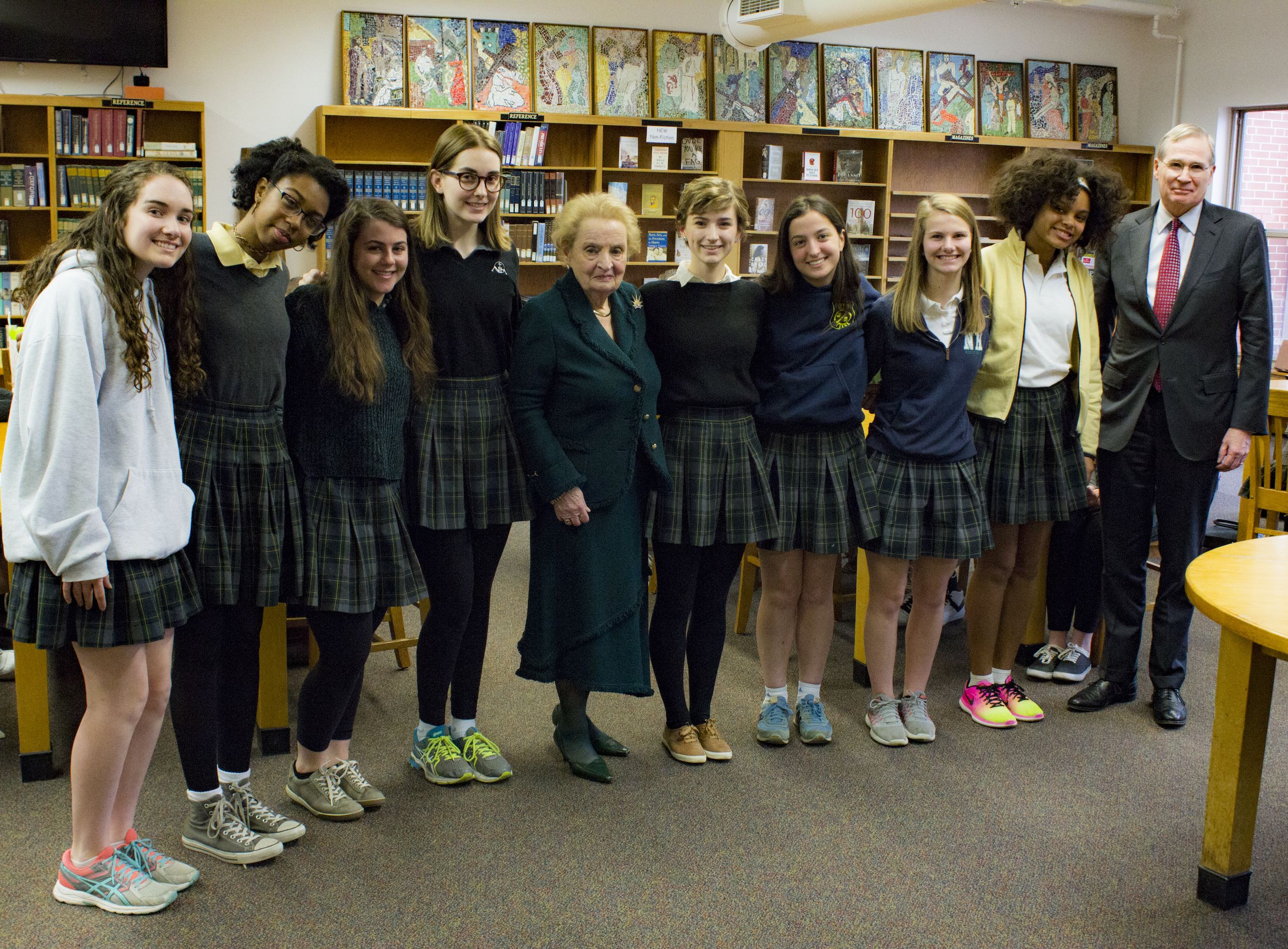 Students involved in a video reflecting on the Middle East Strategy Task Force executive summary, pose with Madeleine Albright and Stephen Hadley, at Nerinx Hall High School in St. Louis, Missouri. Image by Lauren Shepherd, United States, 2017.