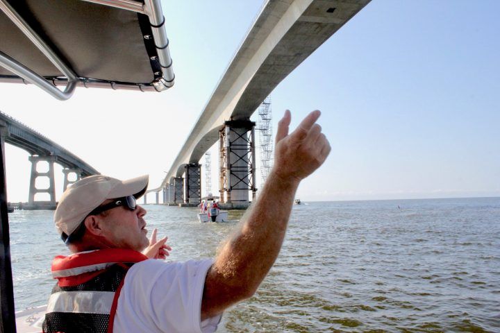 Jerry Jennings points out differences between Bonner Bridge and its replacement in 2018. Image by Kirk Ross. United States, 2018.