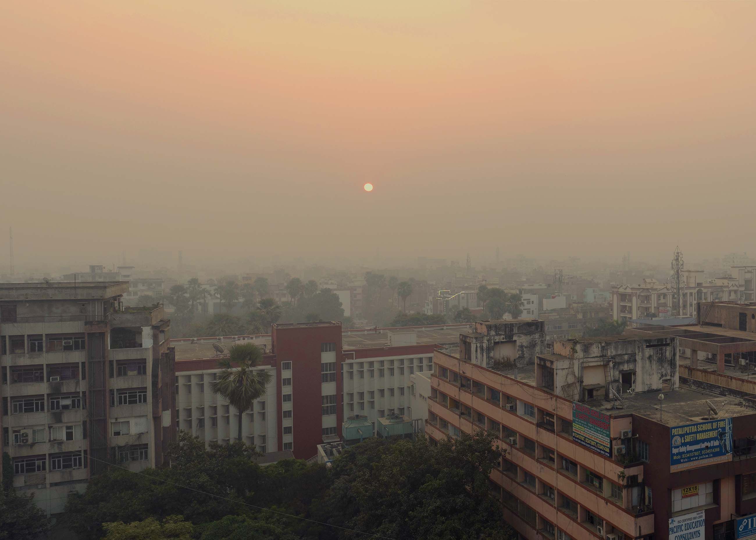 The pollution in the city  builds during the day in sync with heavy traffic and dust thrown into the atmosphere from thousands of construction and highway projects. Image by Larry C. Price. India, 2018.