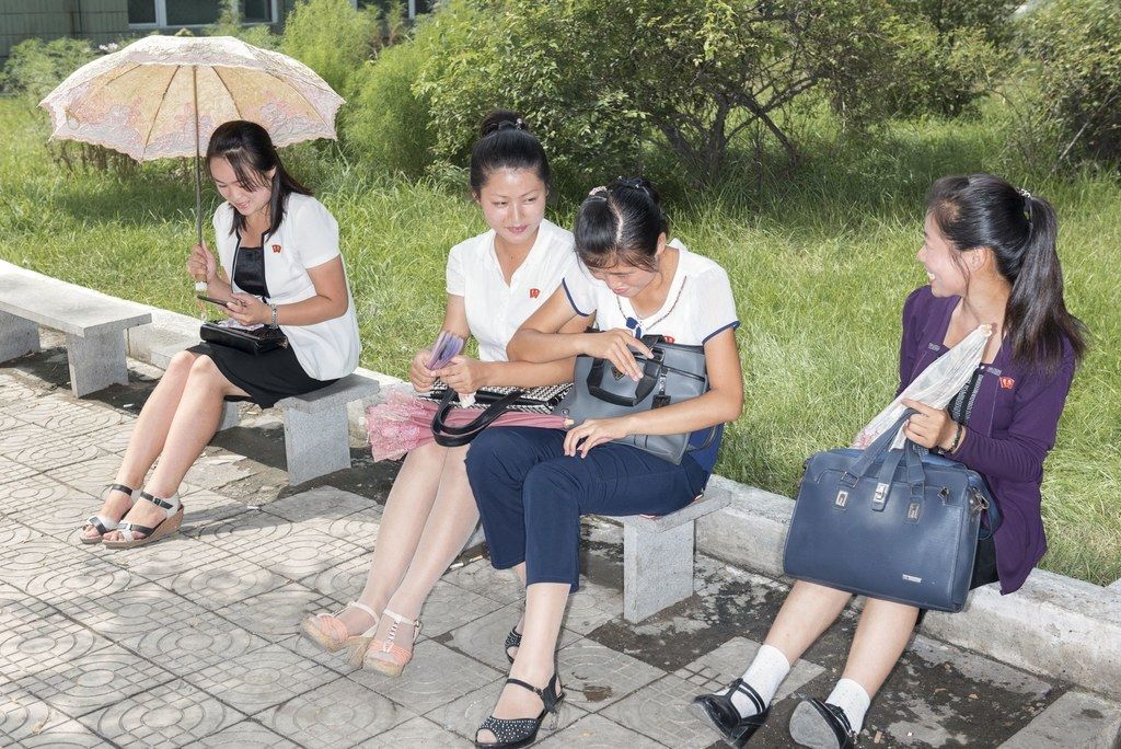 Women along a street in Pyongyang. Image by Max Pinckers/The New Yorker. North Korea, 2017.