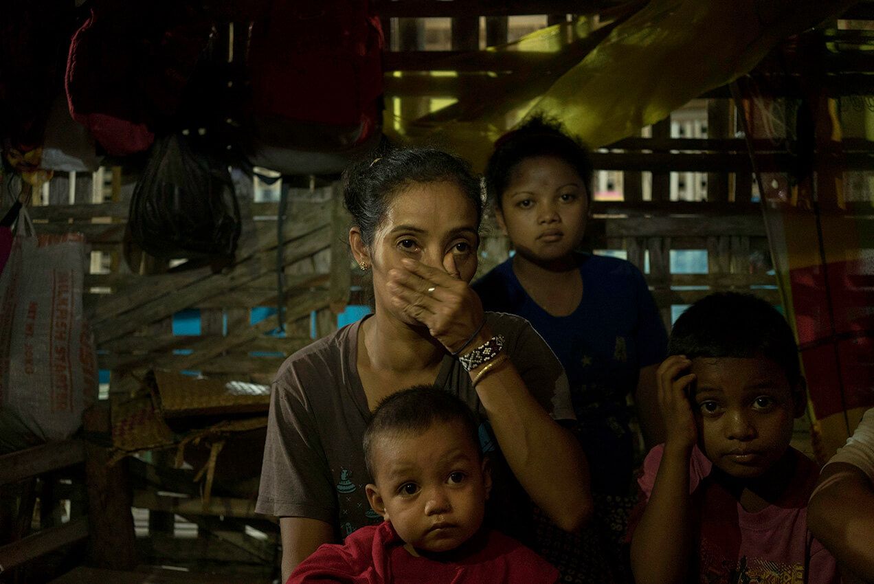 Nelly Danyan sits with other survivors of the shooting in the sanctuary. Image by Chien-Chi Chang/Magnum Photos. Philippines, 2018.