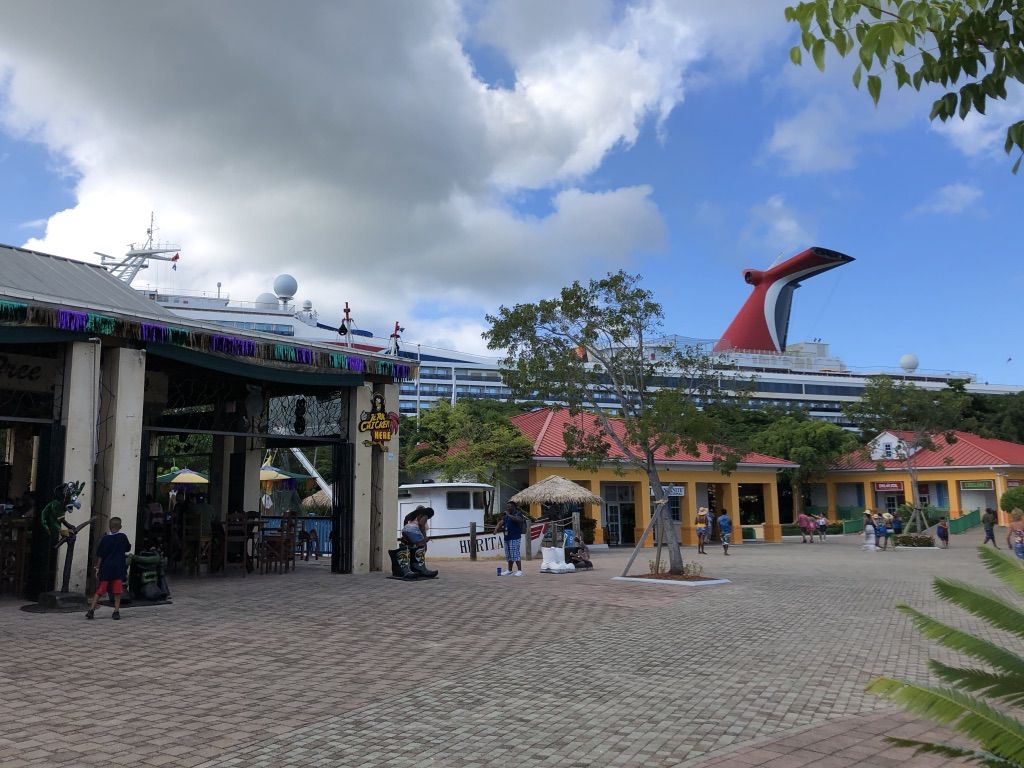 The Carnival Conquest seen from the main plaza at Mahogany Bay, which rents shop and restaurant space to local businesses. Image by Jack Shangraw. Honduras, 2019.