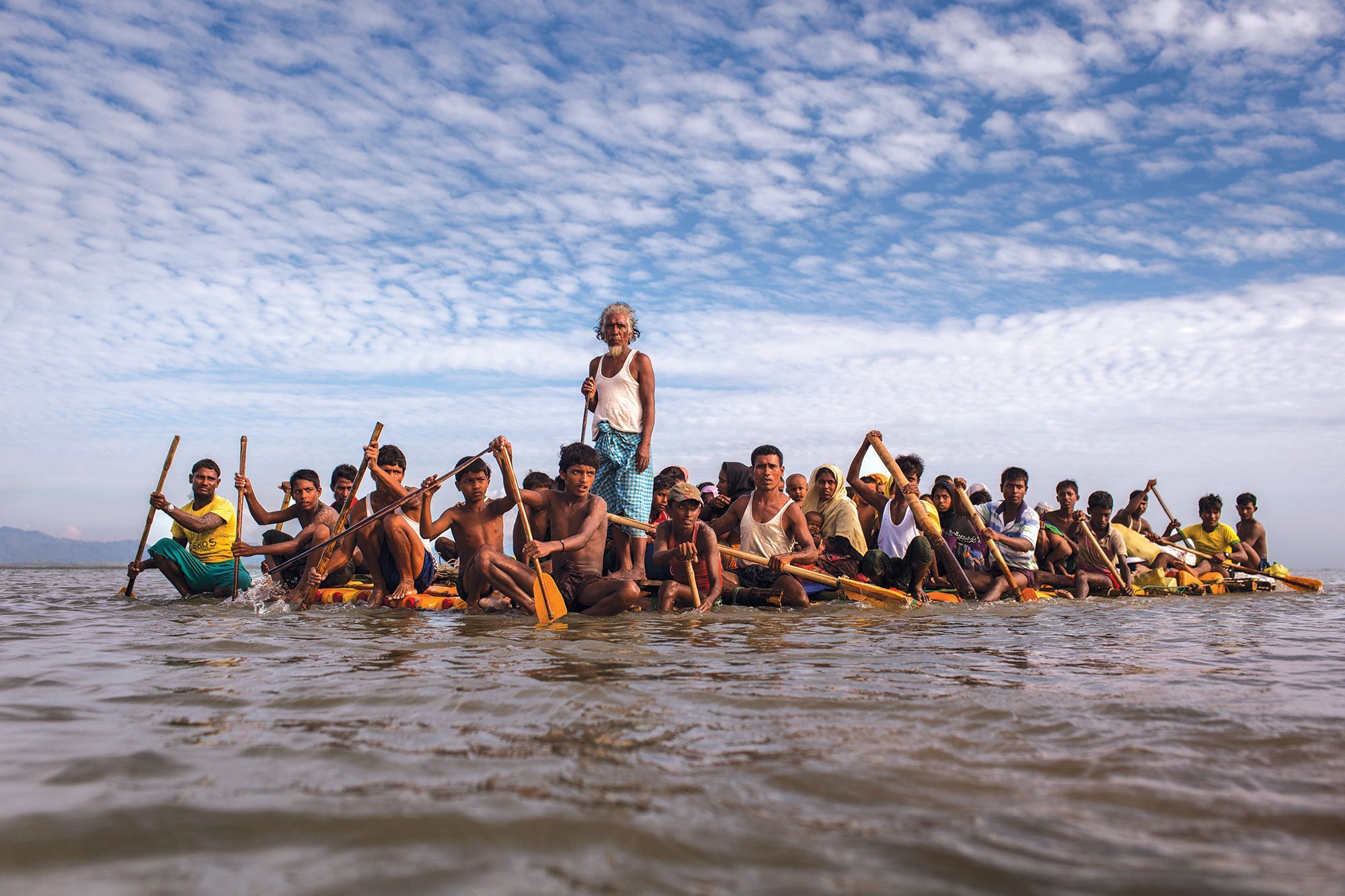 Rohingya fleeing across the Naf River to Bangladesh. The crisis made global headlines in 2015 when boats packed with starving Rohingya were stranded at sea. For weeks, no country would accept them. Image by Patrick Brown/Panos Pictures/UNICEF. Bandladesh, 2017.