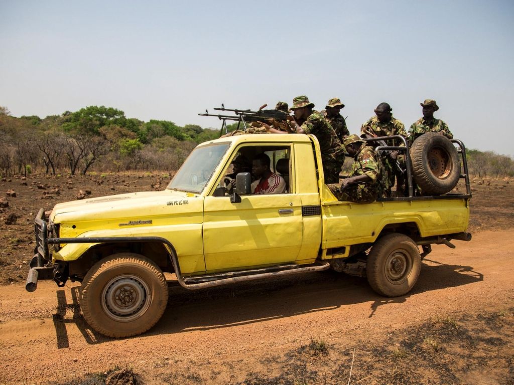 Rangers head back to base from the shooting range. In the words of Stefan Maritz, a South African and Chinko’s acting assistant law enforcement manager: "Our mission is to fight the wrong. In Chinko, there is authority. There are consequences...Once accountability falls away, nothing works anymore.” Image by Jack Losh. Central African Republic, 2018.