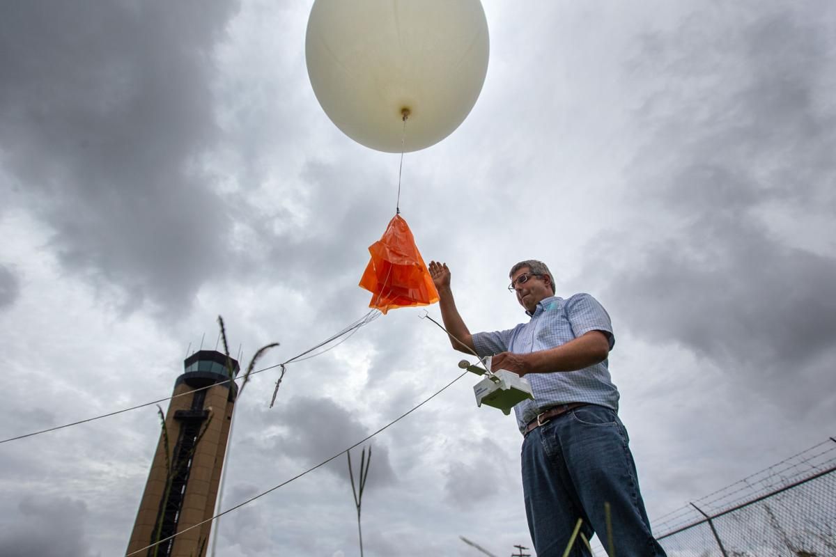 Neil Dixon a meteorologist with the National Weather Service in Charleston, releases a weather balloon with a radio transmitter to record temperature, wind speed and humidity levels on Monday, July 6, 2020, in North Charleston. Andrew J. Whitaker/Post and Courier Staff. United States, 2020.