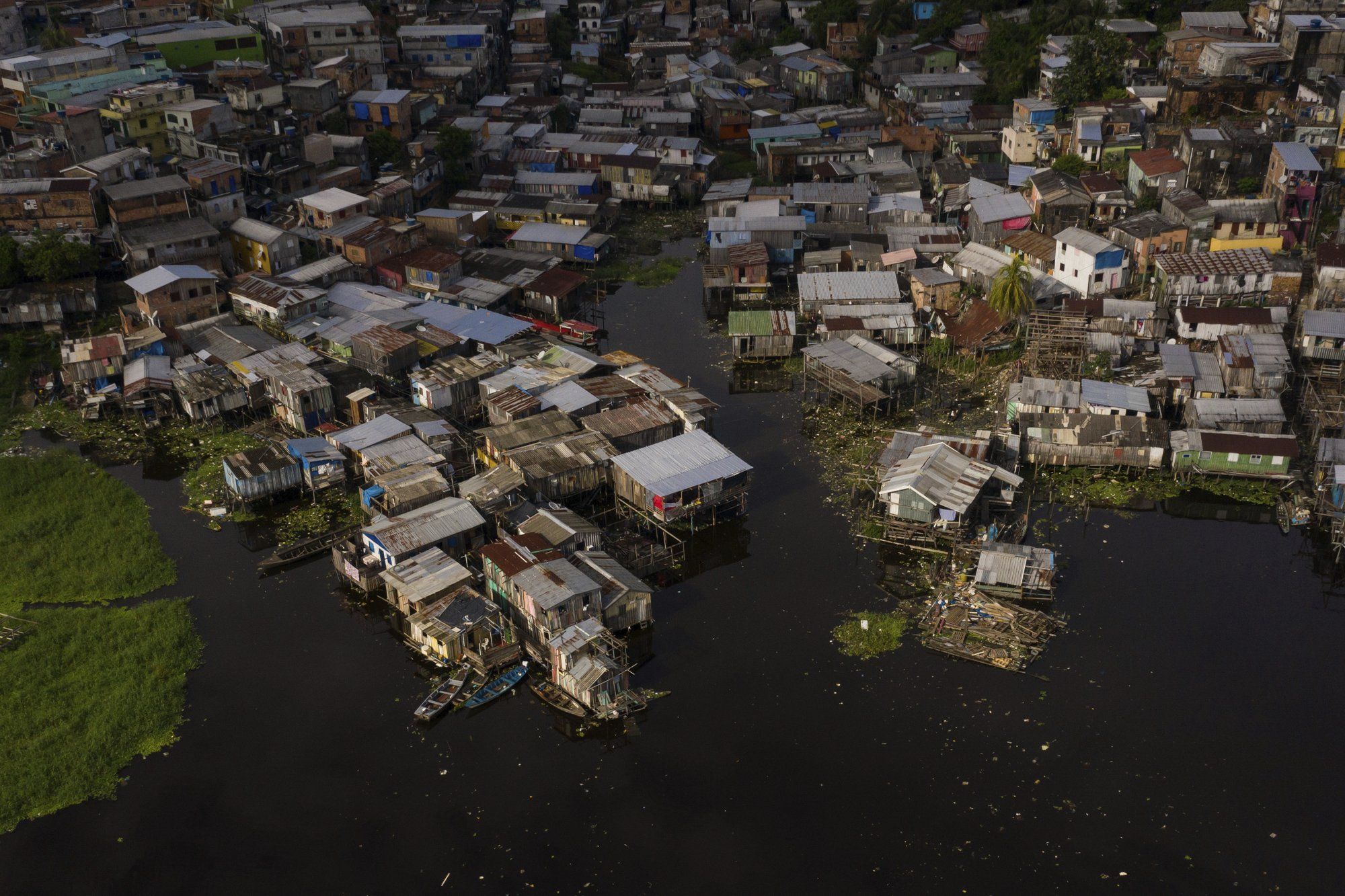 The riverside Educandos neighborhood is seen from above in Manaus, Brazil, Saturday, May 16, 2020. Image by Felipe Dana / AP Photo. Brazil, 2020.