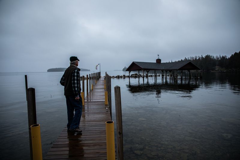 Robert Smith, president of Les Cheneaux Watershed Council, at his home in the Upper Peninsula of Michigan on Nov. 20, 2019. "You're living on the lake, on the lake's terms," he said. Image by Zbigniew Bzdak / Chicago Tribune. United States, 2020.