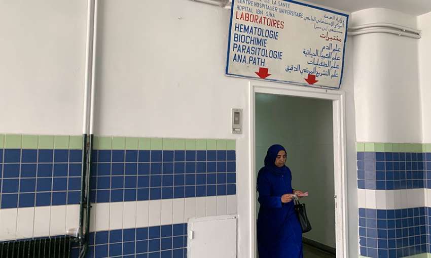 A woman walks out of the hematology laboratory in Hôpital Ibn Sina, a public hospital in Rabat and office of doctor and feminist Asma Lamrabet. Image by Samidha Sane. Morocco, 2019.