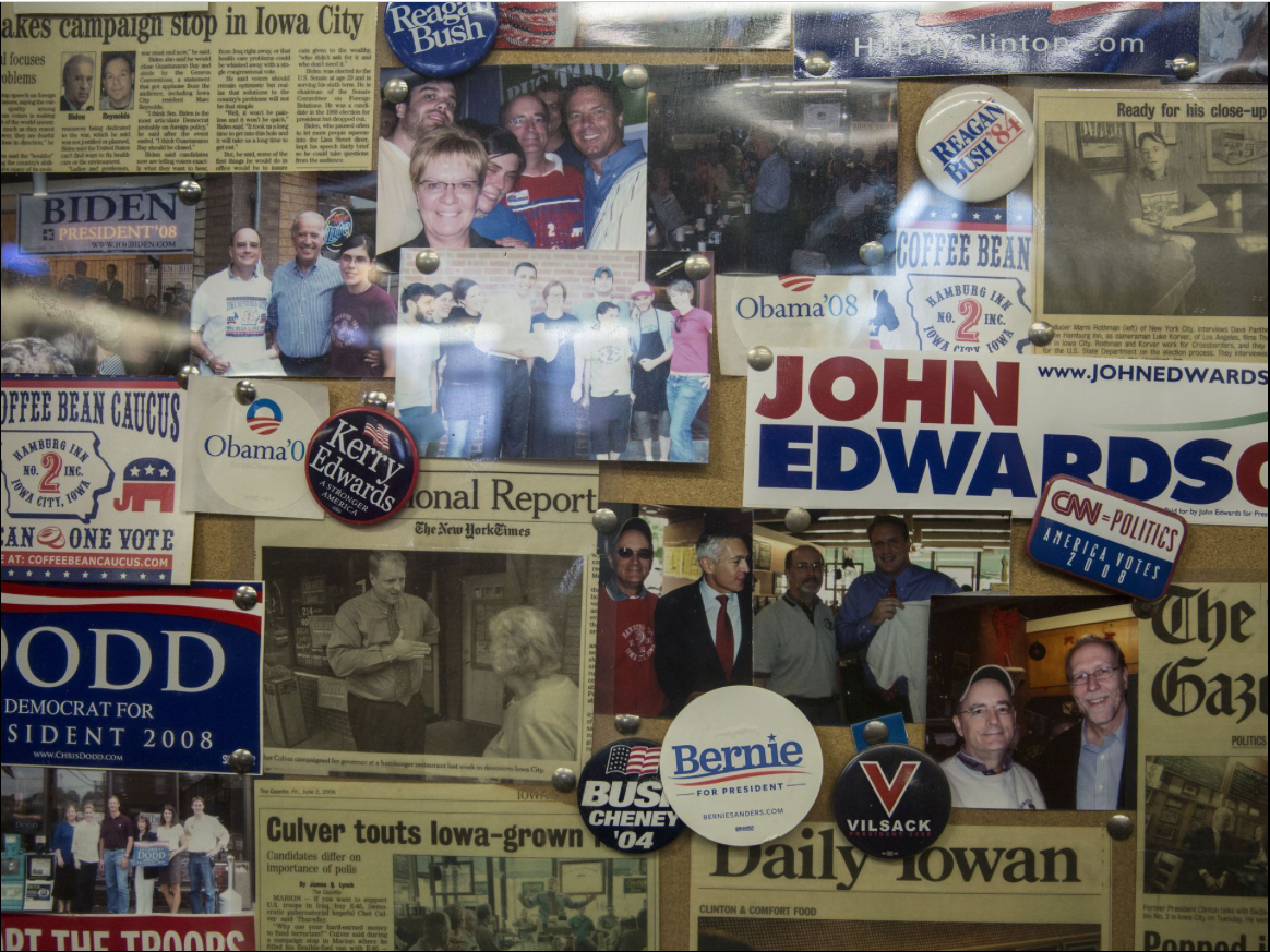 Political buttons and newspaper clippings hang on the wall of the Hamburg Inn No. 2 on Friday. Oct. 6, 2017, in Iowa City. The Hamburg Inn has become a popular place for presidential candidates to visit during caucus season.  Image by Kelsey Kremer. United States, 2017.