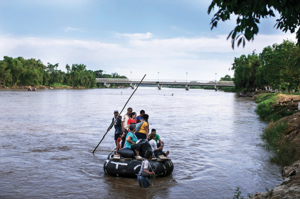 Getting North, Through Whatever Means Possible | People cross the Suchiate River from Guatemala into the Mexican city of Ciudad Hidalgo. Image by Jose Cabezas. Guatemala, 2018.

