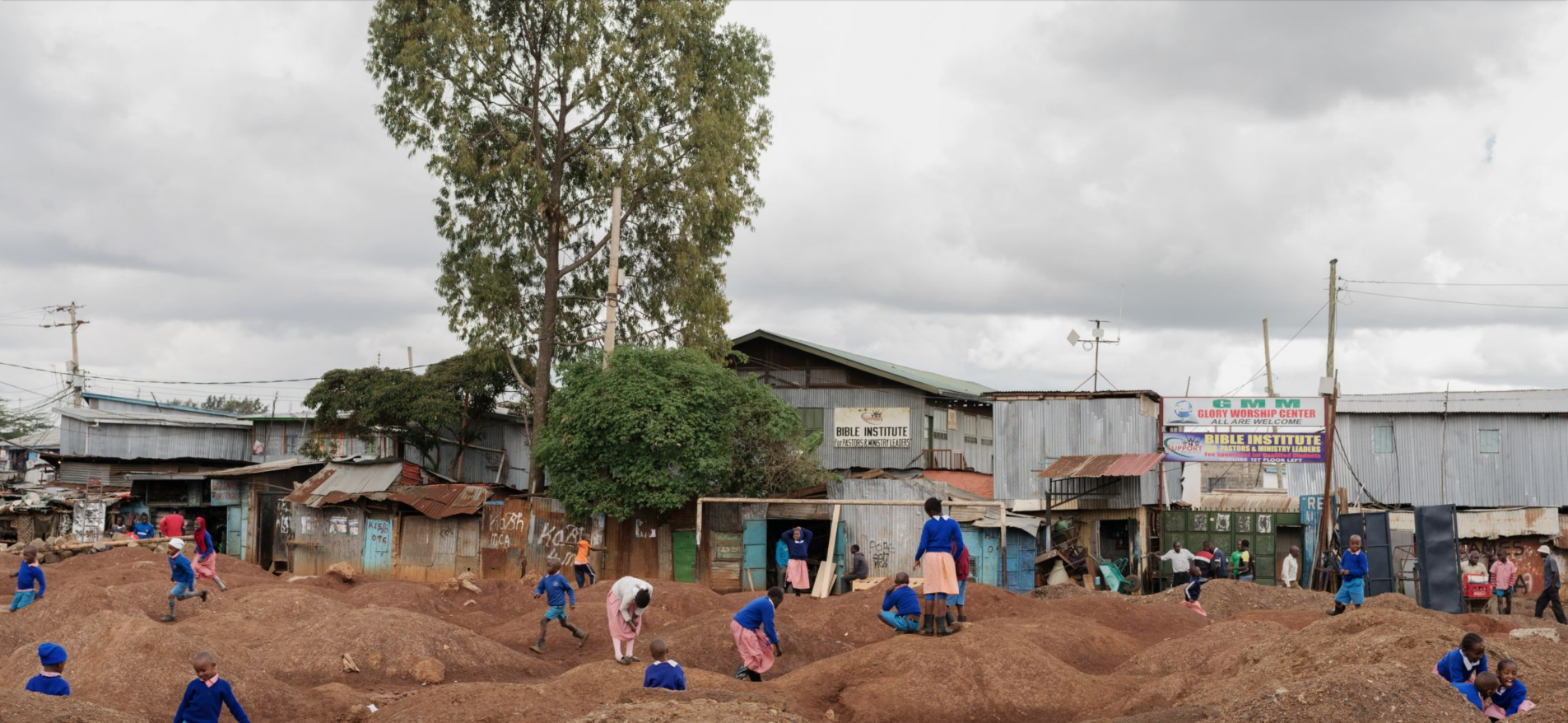 Children play on the Laini Saba football field in Kibera, Nairobi. The field, in a state of incomplete renovation, was reported to the What Went Wrong? survey by Morris Mwendo Mulwa, a local man who plays on a local soccer team that used to practice on this field. Image by Peter DiCampo. Kenya, 2018.