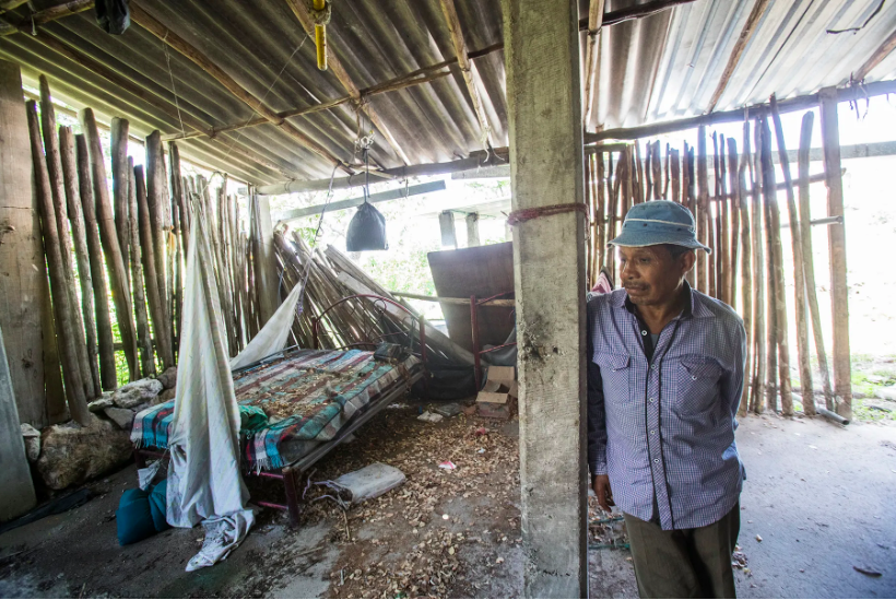 Salomon Lara Tlaltempa visits the home of his 24-year-old son, who was murdered on Jan. 6, 2016, when two dozen armed men stormed into the community and killed six people. Image by Omar Ornelas. Mexico, 2019.