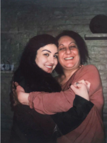 Zahra Ahmad hugs her mother Lamiya Mahdi, who she calls Mama, before leaving to Iraq. Image courtesy of Ahmad family. United States, 2019.