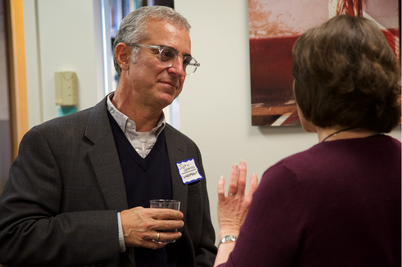 Justin Catanoso, journalism professor Wake Forest, chats with Ann Peters, university and community outreach director at the Pulitzer Center, during lunch on Friday, October 18. Image by Claire Seaton. United States, 2019.
