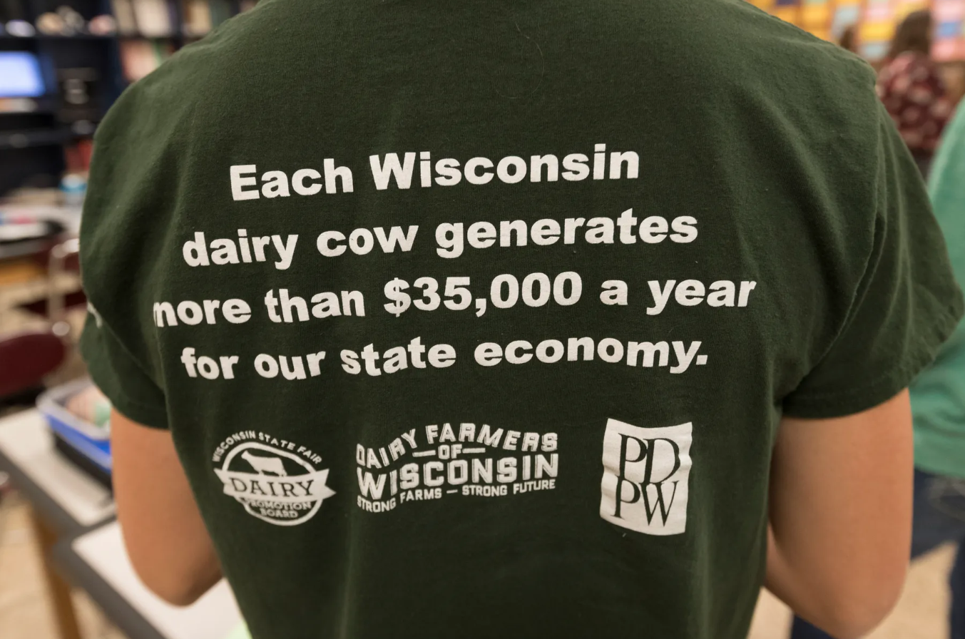 Student Izzi Mason sports a pro-dairy shirt. Image by Mark Hoffman/ Milwaukee Journal Sentinel. United States, 2020.