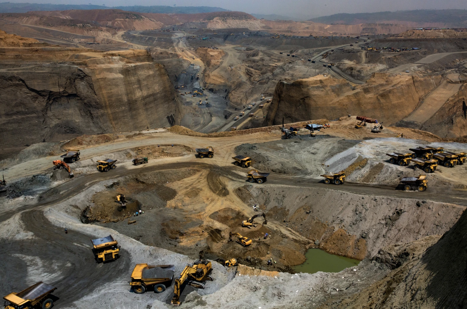 Company trucks operating at a government-licensed jade mining site in Hpakant, Kachin State, Myanmar on May 17, 2019. Image by Hkun Lat. Myanmar, 2019.