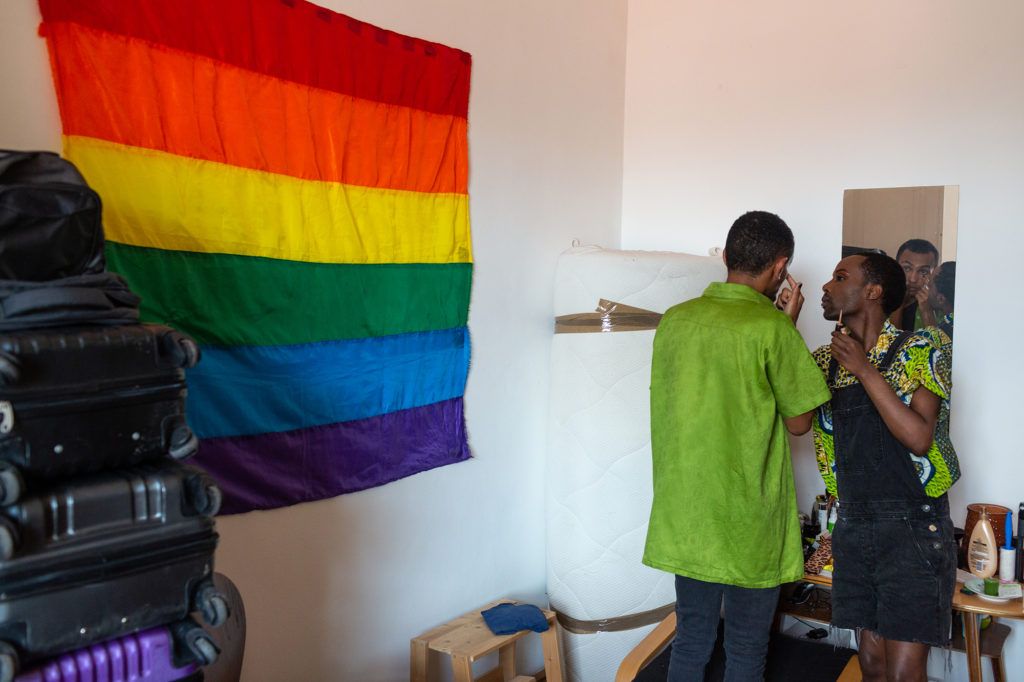As part of a series of online videos explaining LGBTQ rights in Amharic, Faris puts some makeup on their housemate and close friend Noël. Image by Bradley Secker. Austria, 2020.