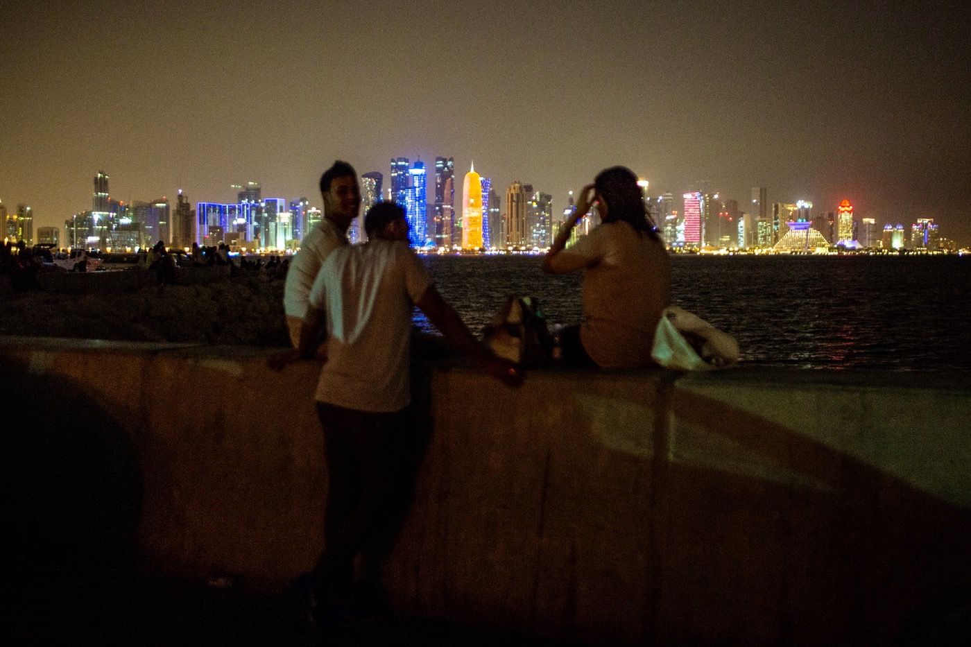 In a country where unmarried sex is outlawed and men and women are socially segregated, people have to find places where they can have sex without being such. This dark parking area along the Corniche, the waterfront promenade around Doha Bay, is a popular spot for couples to get intimate. Image courtesy of News Deeply. Qatar, 2017.