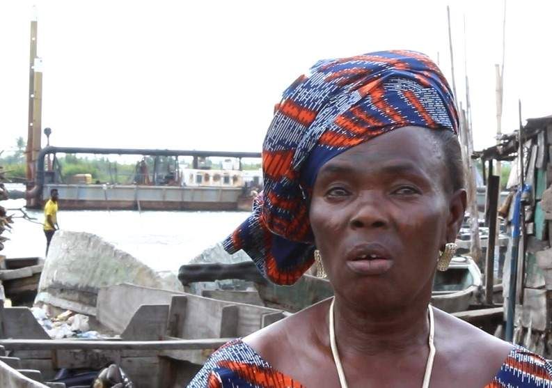 Christiana Gbetode laments the impact of dredging on the fish trade in Bishop Kodji Island. Image by Bukola Adebayo. Nigeria, 2017. 
