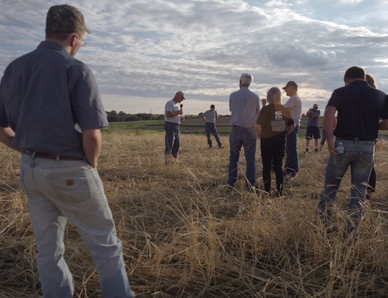 Keota, Iowa. Tim Sieren, addresses Practical Farmers of Iowa (PFI) members about his cover crop strategy. Image by Spike Johnson. United States, 2019.
