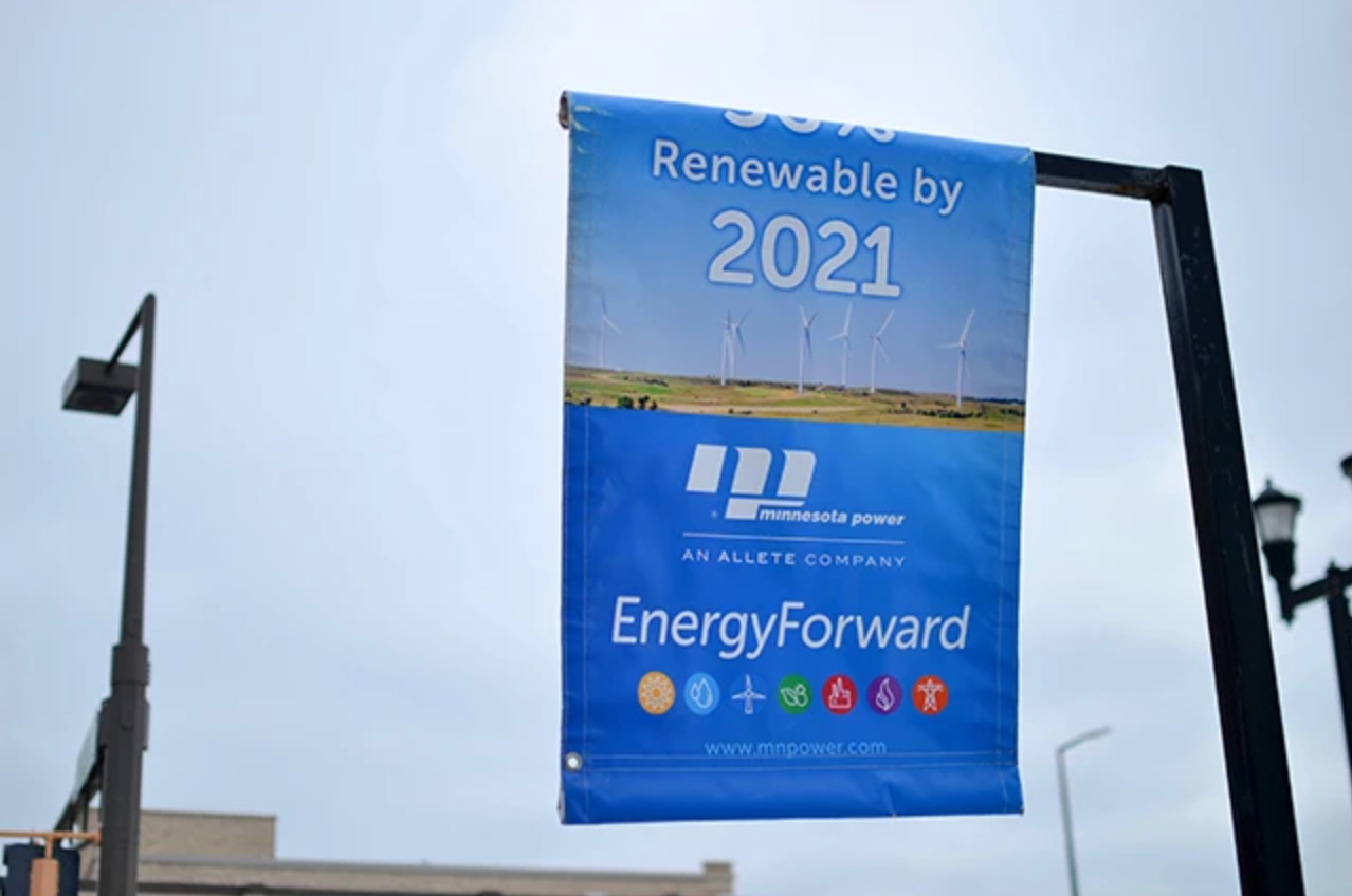 Signs hang in downtown Duluth promoting Minnesota Power's goal to produce 50 percent of its energy from renewable resources by 2021. Image by Walker Orenstein / MinnPost. United States, undated.