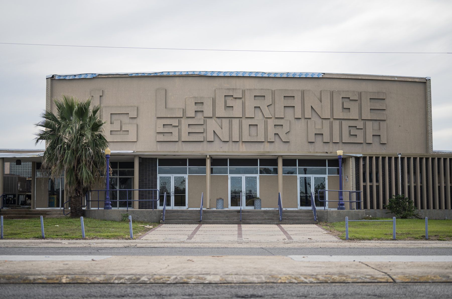 LaGrange High School remains damaged months after back-to-back Hurricanes Laura and Delta passed through the state. Many students and teachers are still displaced, living with relatives or in hotels paid for by the state. Image by Katie Sikora. United States, 2020.
