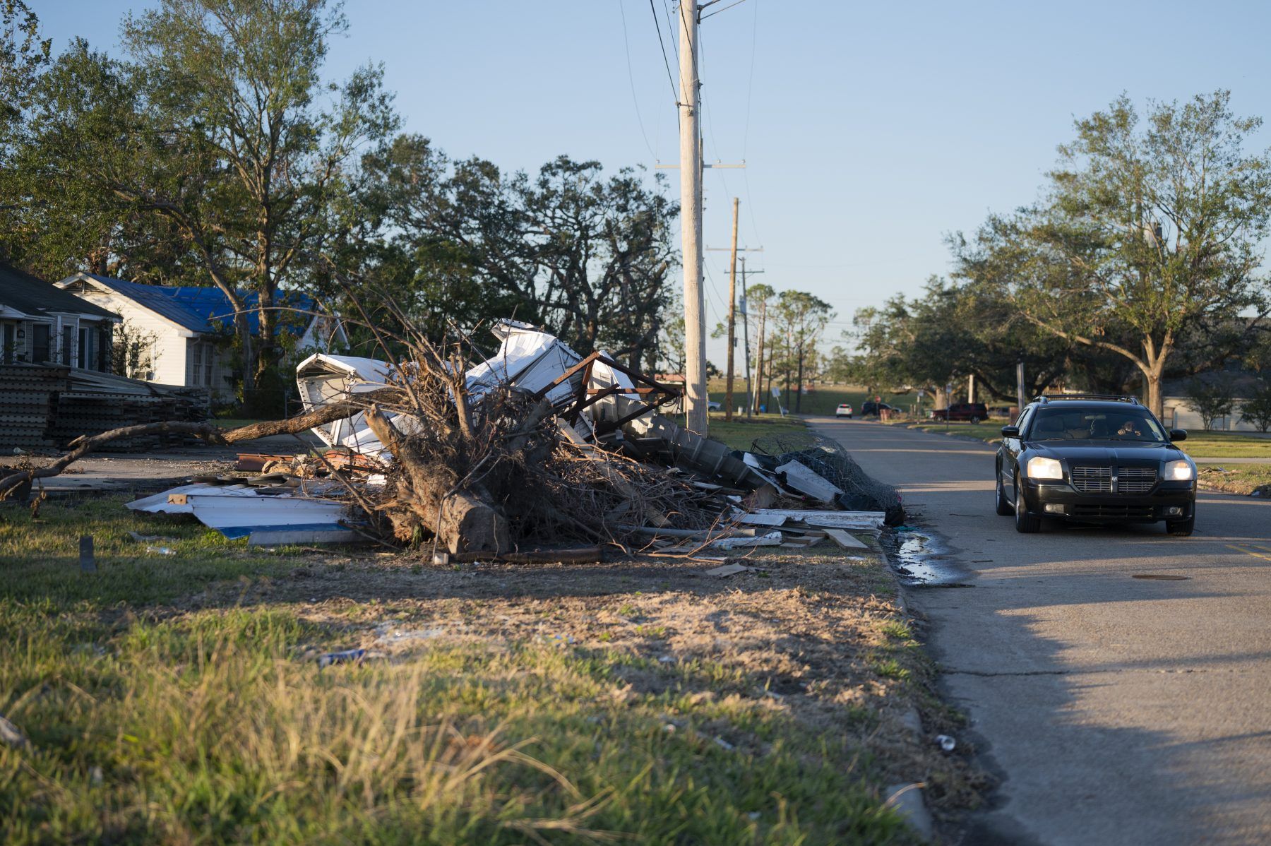The destruction from back-to-back Hurricanes Laura and Delta remains vast in most neighborhoods of Lake Charles. The global pandemic has slowed recovery efforts. Image by Katie Sikora. United States, 2020.
