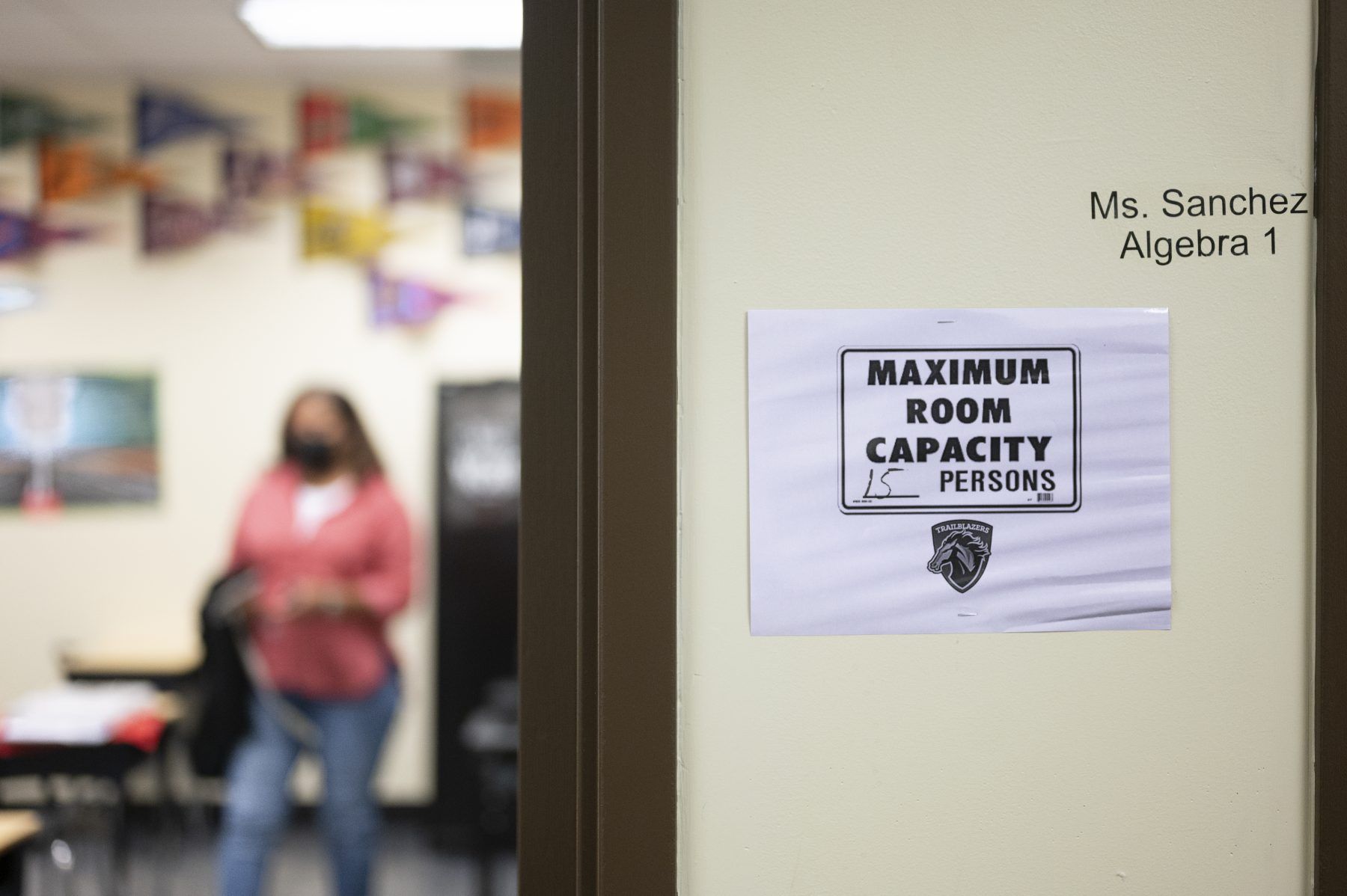 Kelly Hawkins, an English teacher, stands in her classroom at the charter school Lake Charles College Prep. Image by Katie Sikora. United States, 2020.
